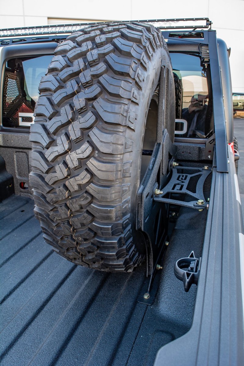 DV8 Offroad 2019+ Jeep Gladiator Universal Stand Up In-Bed Tire Carrier.