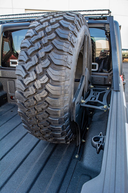 DV8 Offroad 2019+ Jeep Gladiator Universal Stand Up In-Bed Tire Carrier.