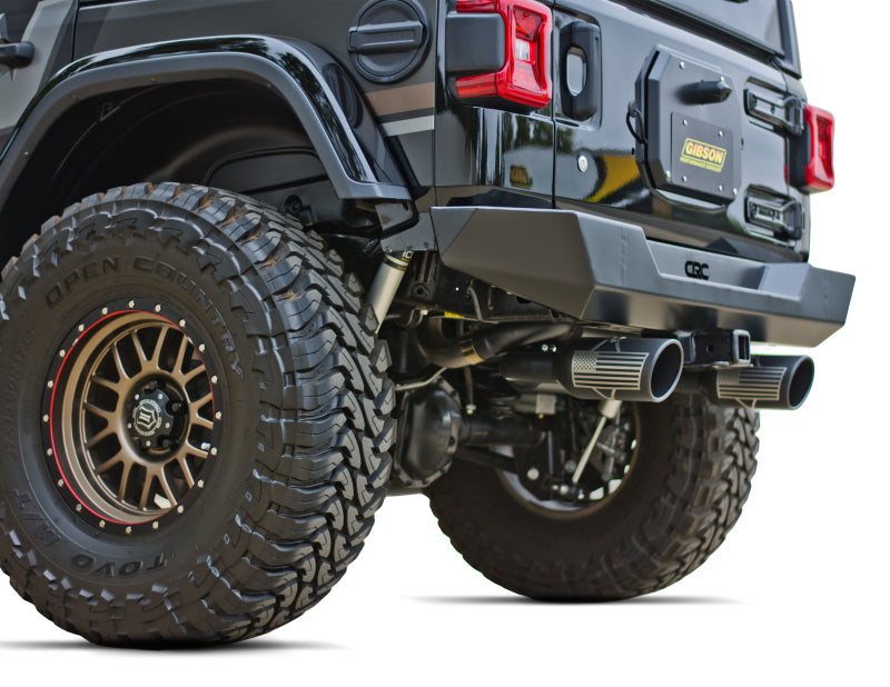 Gibson 12-17 Jeep Wrangler Sport 3.6L 2.5in Patriot Skull Series Cat-Back Dual Exhaust - Blk Ceramic.