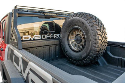 DV8 Offroad 2019+ Jeep Gladiator Universal Stand Up In-Bed Tire Carrier.