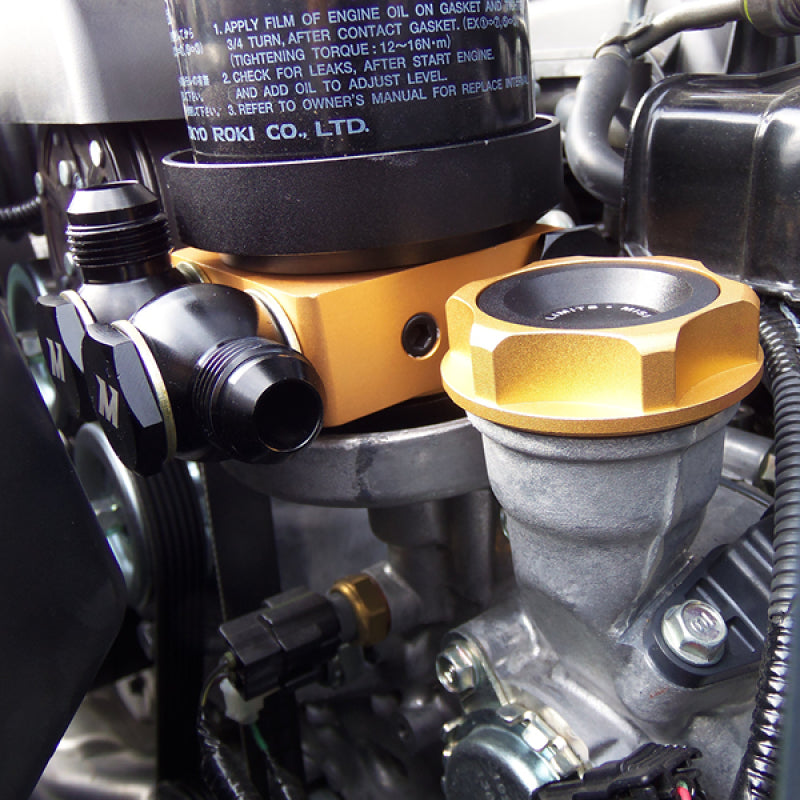 Mishimoto Oil Sandwich Plate w/ Rear-Mounted Thermostat.