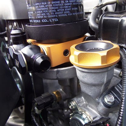 Mishimoto Oil Sandwich Plate w/ Rear-Mounted Thermostat.